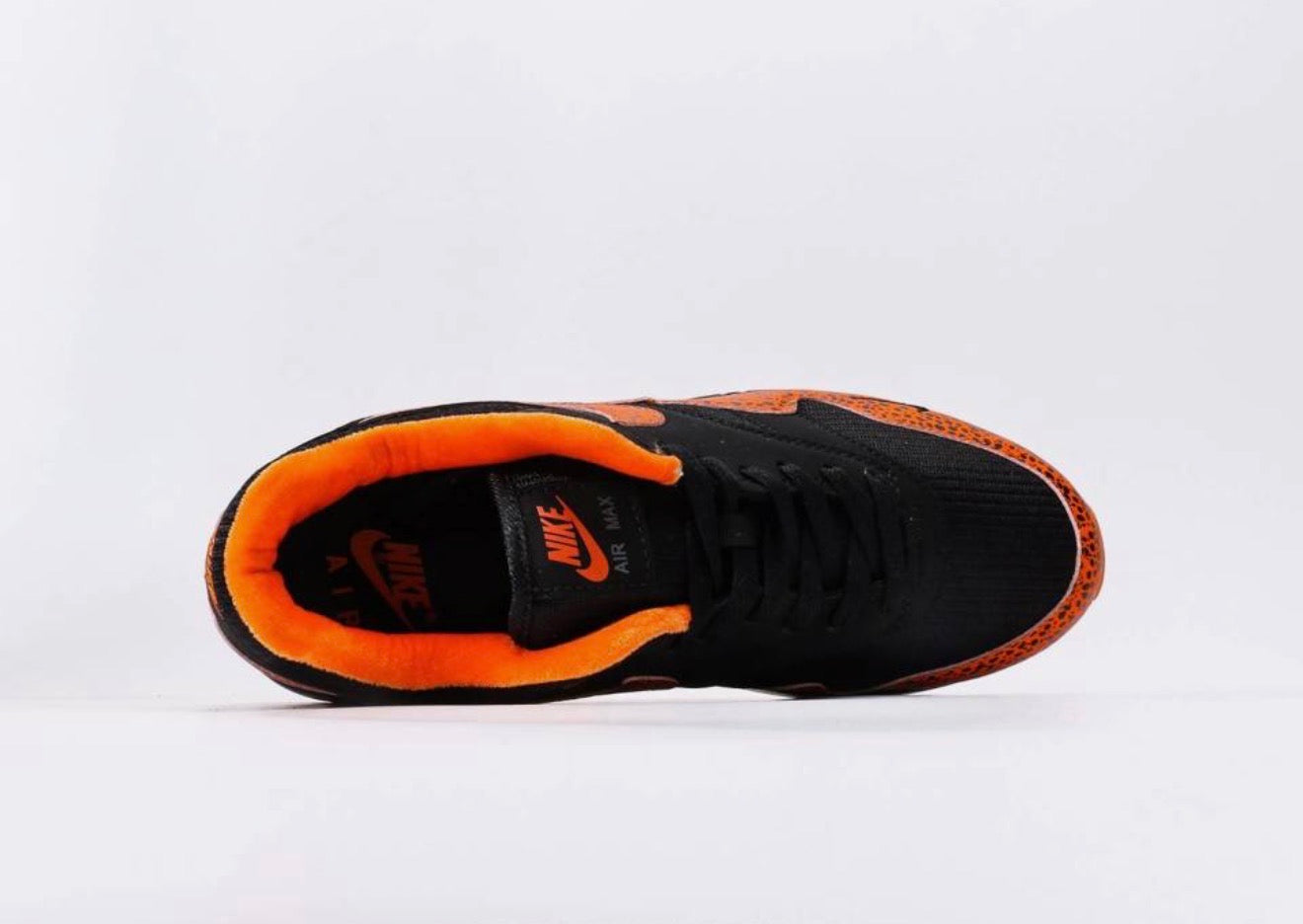 Nike Air Max 1 "Safari Orange and Black Grouper" (parfois répertoriée sous le code couleur noir et orange avec imprimé safari ou léopard)